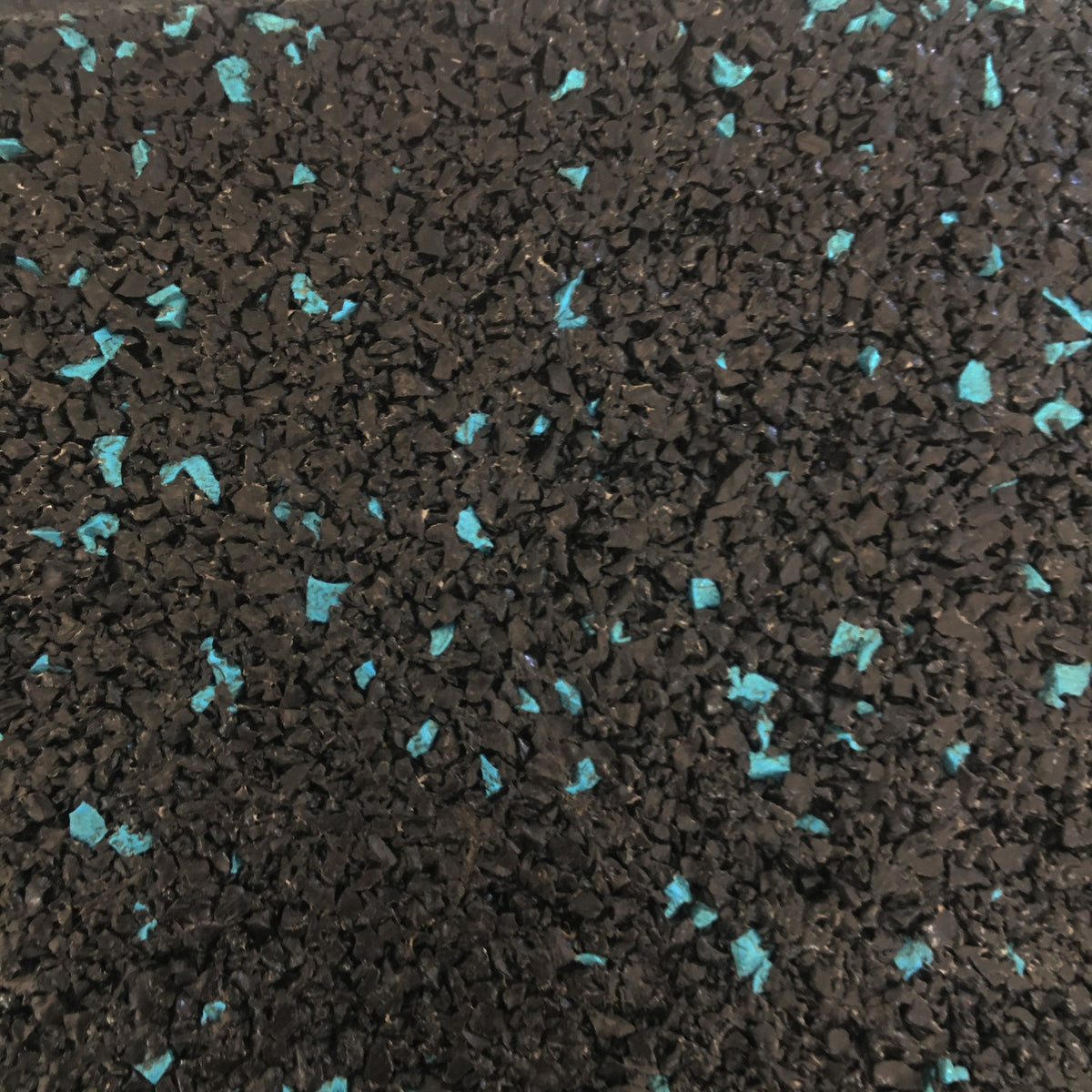 Close-up of blue fleck in black ACTIV rubber flooring.